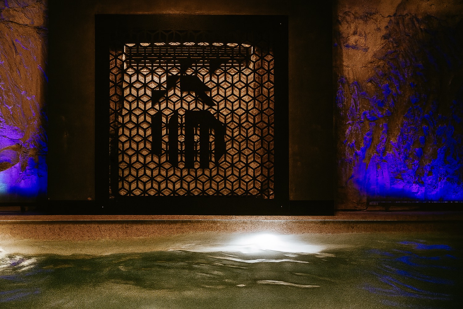 Mythos Fitness Complex — branded spa pool with ambient lighting